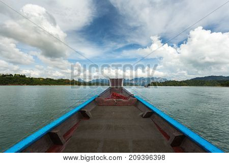 The Nose Of A Long-tailed Boat Against The Background Of The Karst Rocks Of Lake Cheo Lan