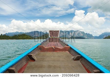 The Nose Of A Long-tailed Boat Against The Background Of The Karst Rocks Of Lake Cheo Lan