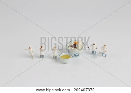 Tiny Of Cook Are Talking In The Kitchen.