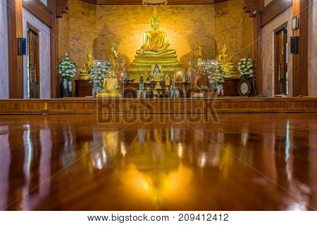 Sukhothai Thailand - August 7 2017: Golden Buddha Image with monk statue in beautiful Buddhist temple where Buddhist to worship in Sukhothai Thailand