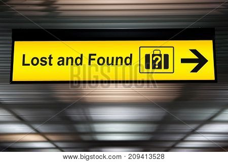 Lost and Found sign hanging from ceiling at the Airport