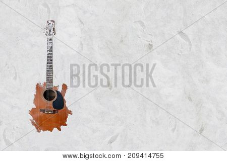 The guitar in the white sand on the beach