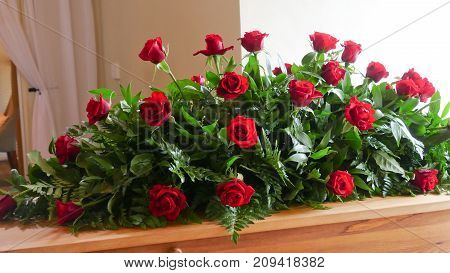 closeup shot of a colorful casket in a hearse or chapel before funeral or burial at cemetery