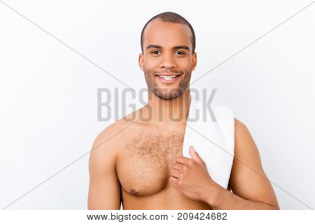 Cheerful Young Naked Afro American Guy Is Standing On The Pure White Background, With Towel On The S