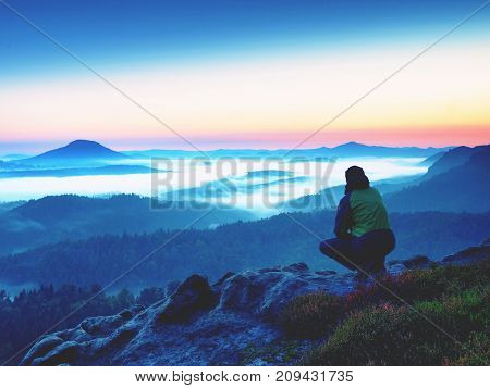 Hiker  Man On Rock Watch Over Creamy Mista And Foggy Morning Landscape.