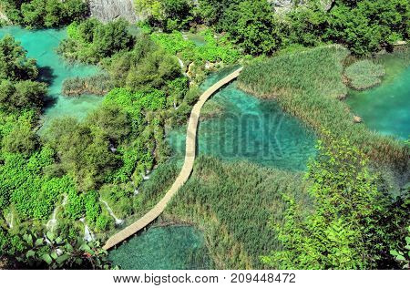 Aerial view Plitvice Lake's famed sapphire water waterfalls and serpentine walkway.