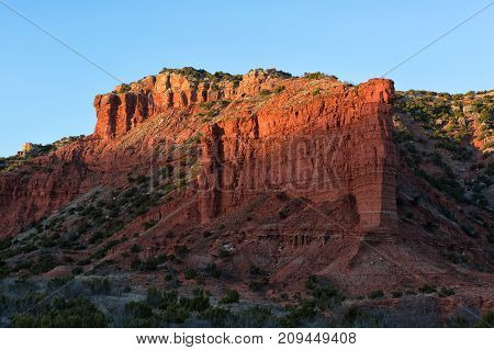 red cliff in the last rays of sunset at Caprock Canyon Texas