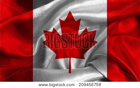 Realistic flag of Canada on the wavy surface of fabric. This flag can be used in design.