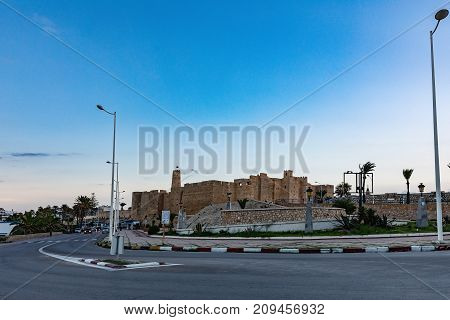 Evening view on Ribat in Monastir in Tunisia Africa in summer day. Stone fortress Ribat with a tower in the city of Monastir. Tunisia