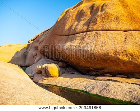 Small water basin in Spitzkoppe rock formation, Namib Desert, Namibia, Africa.