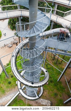 LIPNO NAD VLTAVOU, CZECH REPUBLIC - 26 September 2017. Spiral slide tube in the middle of The Treetop Walkway, Lipno nad Vltavou, Czech Republic.