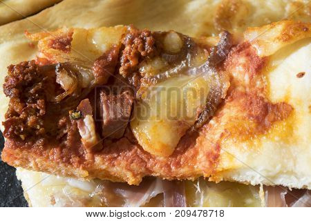 homemade pizza with tomato sauce and cured ham