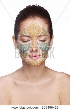 portrait of a girl with a cosmetic mask on her face