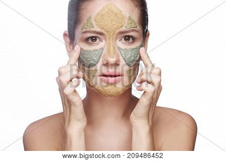 portrait of a girl with a cosmetic mask on her face