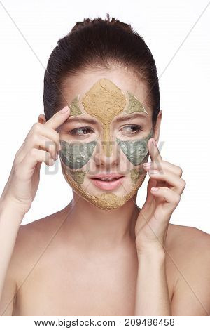 portrait of a girl with a cosmetic mask on her face