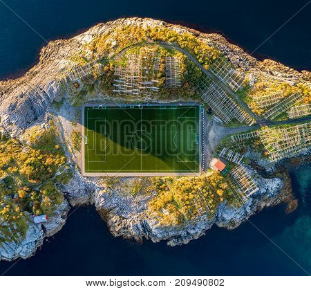 Football field in Henningsvaer from above. Henningsvaer is a fishing village located on several small islands in the Lofoten archipelago in Norway.