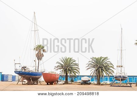 WALVIS BAY NAMIBIA - JULY 1 2017: Yachts on dry land at the yacht club in Walvis Bay on the Atlantic Coast of Namibia