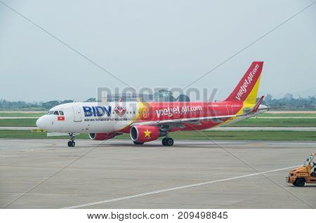 Hanoi, Vietnam - August 19, 2015: Vietjet Air Airbus A320 on the tarmac at Hanoi airport. Vietjet Air is a Vietnamese budget airline.