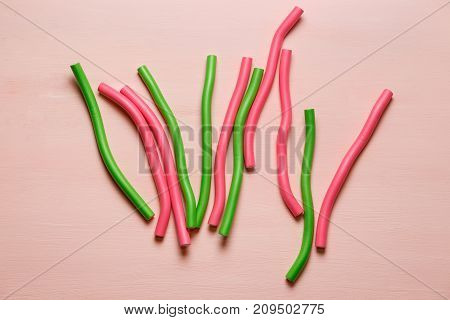 hair curlers isolated on light pink background. Top view flat lay composition for articles, magazines, bloggers, designers etc.