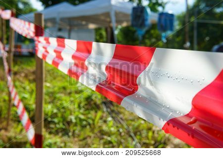 Red And White Tripped Tape Fence For Barricades Or Murder Zones Or Crime Scene.