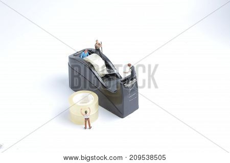 Mini Of Worker Replace The Tape For Dispenser