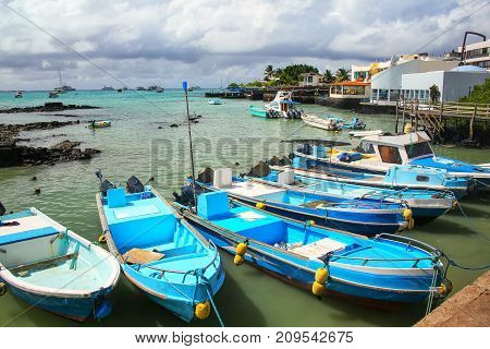 Boats anchored at Puerto Ayora on Santa Cruz Island Galapagos National Park Ecuador. Puerto Ayora is the most populous town in the Galapagos Islands.