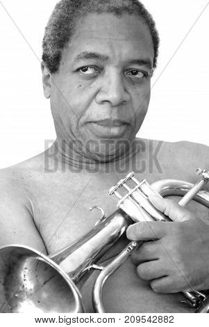 African american jazz musician expressions with his flugelhorn indoors.
