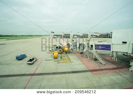 BANGKOK THAILAND  21 JULY 2017: NOKAIR airline loading cargo on the plane at the gate in Don Mueang international airport (DMK)