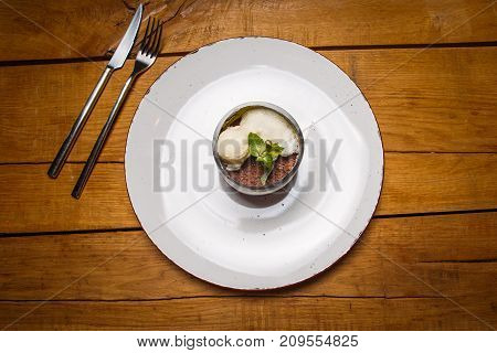 Ice Cream Sweet Dessert On A White Plate On A Wooden Table In An Italian Retor. Ingredients White Ic