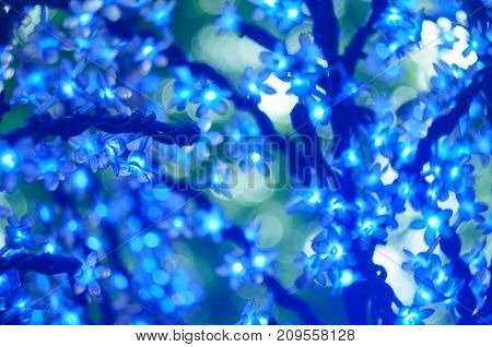 Christmas Led Lights In The Form Of Flowers, Blue Bokeh, Selected Focus