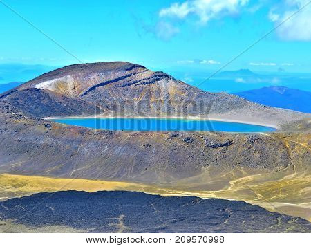 blue lake between montains. Tongariro, New Zealand