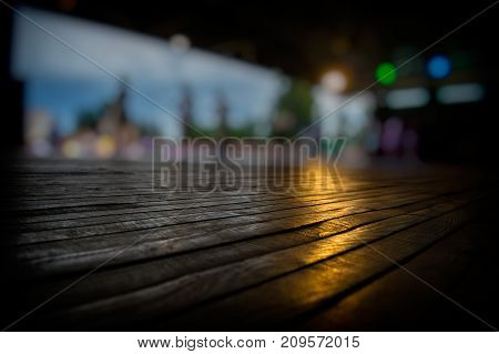 lurred silhouettes of people and dance floor in an open area