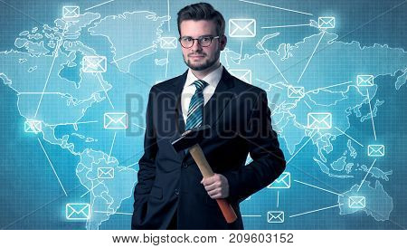 Businessman holding tool with global map graphic on the background