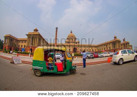 Jaipur, India - September 26, 2017: Beautiful goverment building of Rashtrapati Bhavan is the official home of the President of India, with some richshaw parked at outdoor, fish eye effect.
