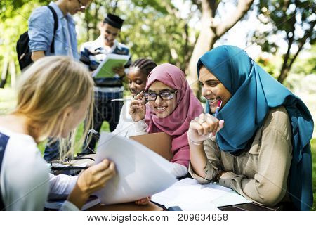 Diverse children studying outdoor