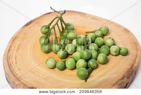Turkey Berry (solanum Torvum) On Chopping Wooden Background