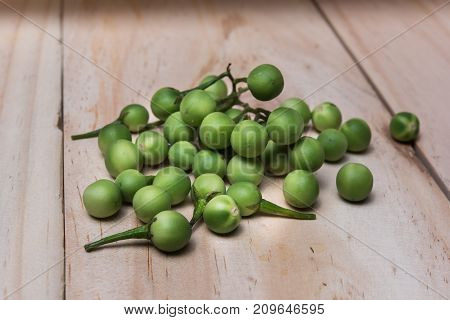 Turkey Berry (solanum Torvum Sw.) On A Wooden Floor