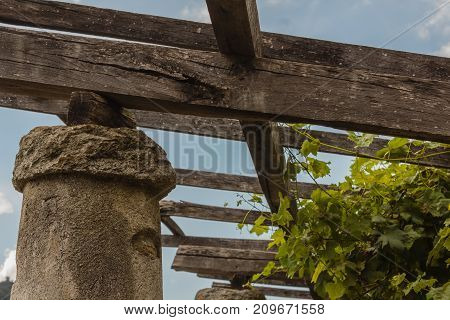 a pylon stone and lime with the span on which the pergola of vineyards is supported /detail of a pylon in stone and lime of the vineyards  of Carema,Piedmont,Italy