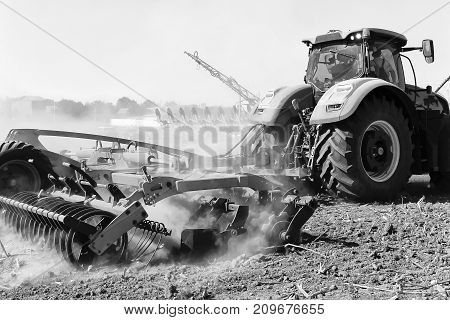 Agriculture. The Tractor Prepares The Ground For Sowing And Cultivation.    Work Of A Plow On The Fi