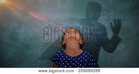 Graphic image of businessman running with breifcase against girl standing with head back