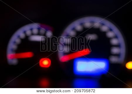 Defocused modern car dashboard. Bokeh background. Concept of drunkenness driving