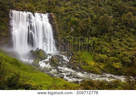 Marokopa Falls near Waitomo with heavy flow of water after winter storms.