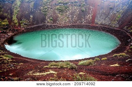 Kerid volcanic crater lake on the touristic golden circle route in Iceland