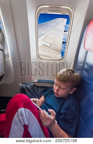In The Cabin Of The Plane The Boy