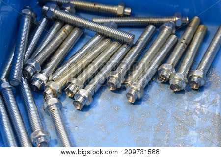 The screw stud bolt in the container box.Construction pare part in the box