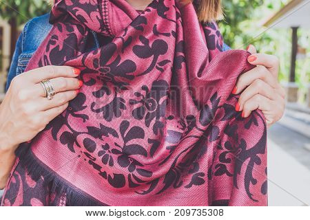 Yong woman hands with cashmere scarf. Bali island. Fashion shot.