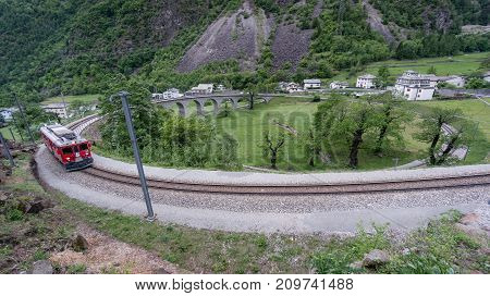 Brusio Switzerland - May 2017: Circular viaduct bridge near Brusio on the Swiss Alps