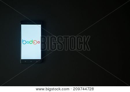 Los Angeles, USA, october 19, 2017: Badoo logo on smartphone screen on black background.