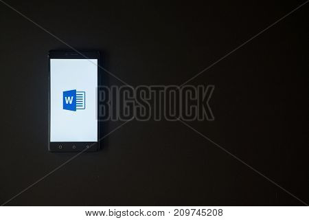 Los Angeles, USA, october 19, 2017: Microsoft office word logo on smartphone screen on black background.