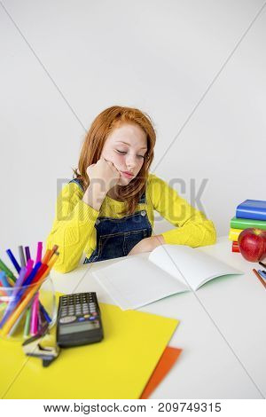 Smart girl is sudying and doing her homework